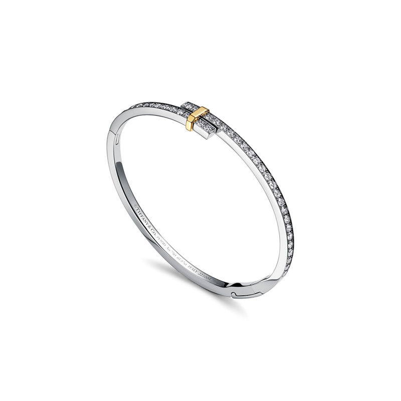 Tiffany & Co. Tiffany Edge Brazalete Hinged Bypass en platino y oro amarillo con diamantes En oferta