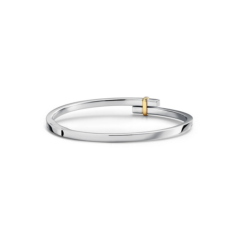 Tiffany & Co. Tiffany Edge Brazalete Hinged Bypass en platino y oro amarillo con diamantes En oferta