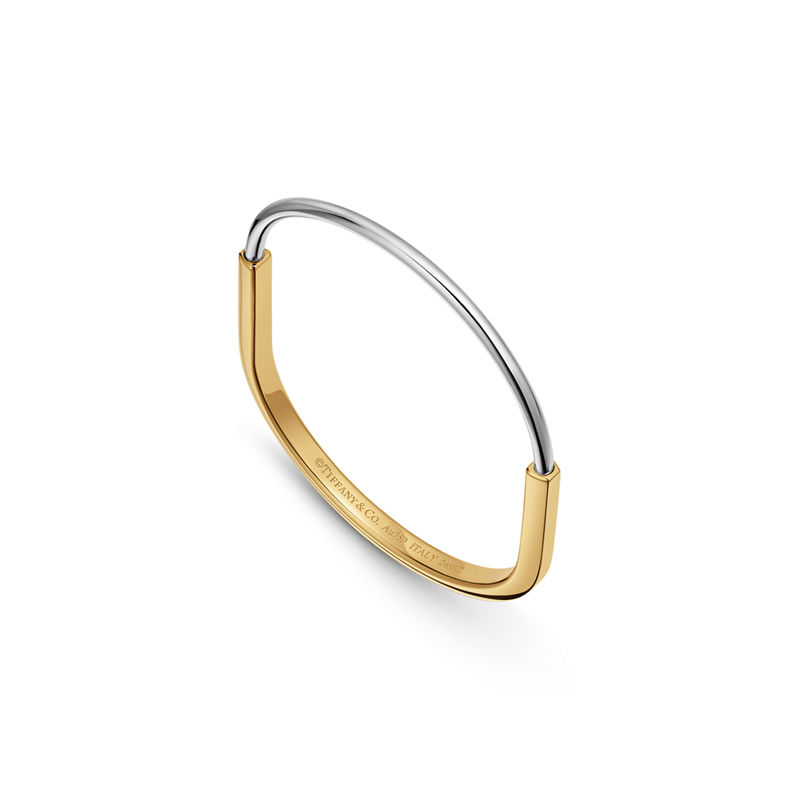 Tiffany & Co. Tiffany Lock Brazalete estrecho de oro amarillo y blanco Ahorra y exporta